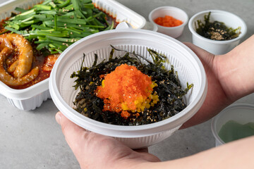 Beef gopchang gopdoritang, flying fish roe rice balls, and gopchang jeongol Korean food dish