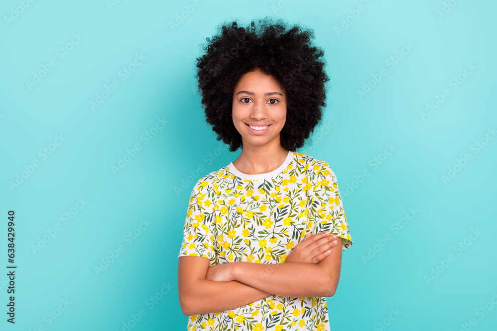 Poster Photo of satisfied young schoolchild girl crossed hands wear summer trend t shirt print yellow flowers isolated on blue color background