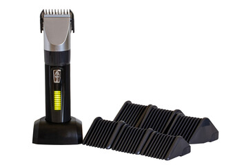 Close-up of a new black silver rechargeable beard and hair clipper with various attachment object...