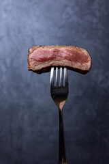 Delicious marbled meat on a dark background. Close up