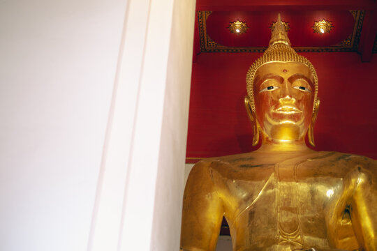 Gold Buddha statue inside a temple