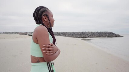 woman felling cold on the beach cloudy morning in winter woman shiver with cold