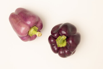 Purple bell peppers isolated on white