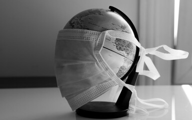 World globe wearing surgical mask to fight corona virus covid 19 pandemic