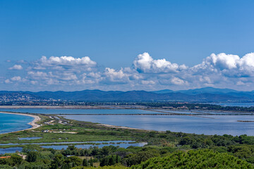 Aerial view of Giens peninsula on a sunny spring day with Mediterranean Sea, beach and saline in the background. Photo taken June 8th, 2023, Giens, France.