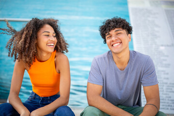 young happy couple sitting together