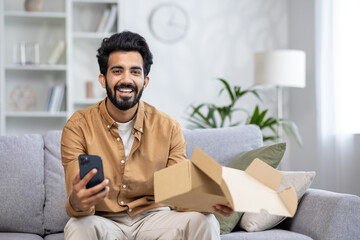 Portrait of a happy buyer in an online store, the man received the parcel on time and quality...
