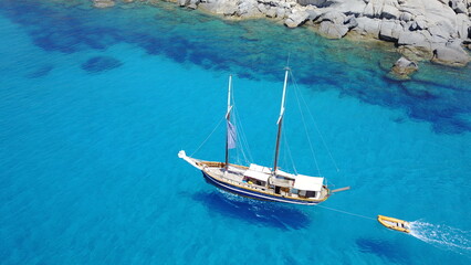 Boat, sailing in blue water and summer sun on ocean holiday, relax in freedom and nature. Yacht...