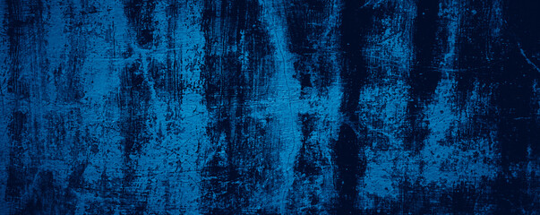 Abstract blue grungy black wall texture background