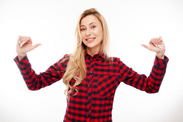 Portrait of young blonde woman smiling, looking confident, pointing oneself with fingers isolated...