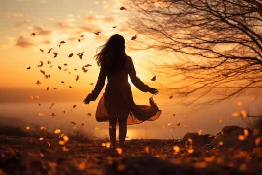 Silhouette of a person releasing leaves into the wind at dusk - Letting Go - Autumn Season - AI Generated