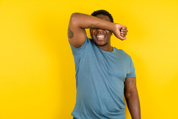 MODEL covering eyes with arm smiling cheerful and funny. Blind concept.