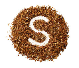 Letter S made of cigarettes dried smoking tobacco on white background