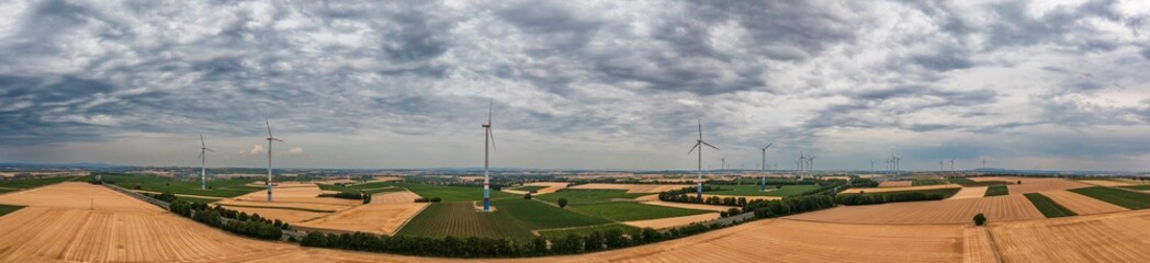 Fototapeta na wymiar Bird's-eye view of grain fields in Rhineland-Palatinate/Germany and a few wind turbines