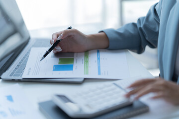 Hand of businesswomen working with pepper line chart in the office