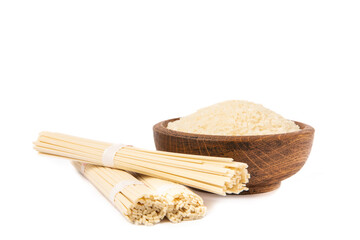 Funchoza.Dried raw rice noodles and rice isolated on white background..Noodles with rice flour. Diet food. Healthy food. Design