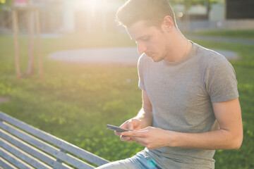 Young man using smart phone outdoor