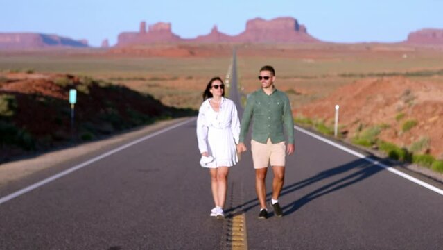 Scenic highway in Monument Valley Tribal Park in Utah. Young family on famous road in Monument Valley