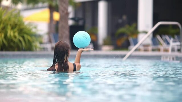 Teen girl swimming in pool