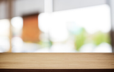 Mock up for space. Empty dark wooden table in front of abstract blurred bokeh background of restaurant . can be used for display or montage your product