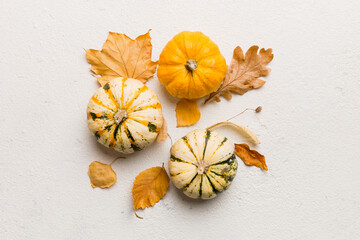 Fototapeta premium Autumn composition. Pattern made of dried leaves and other design accessories on table. Flat lay, top view