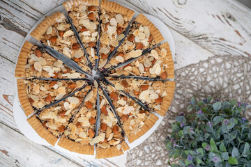round of slice cheese pie on a white desk