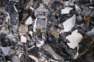 Flint on living rocks, a small pile of sharp stones