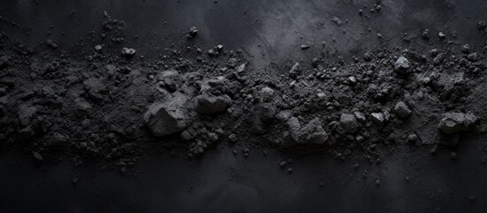 Dirty cement contrasting against a black backdrop
