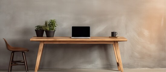 Laptop on high wooden table in modern interior for standing work