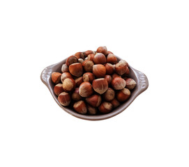 Hazelnuts in a shell on grey plate isolated object minimalist concept of healthy food diet and eco-friendly lifestyle, nuts heap