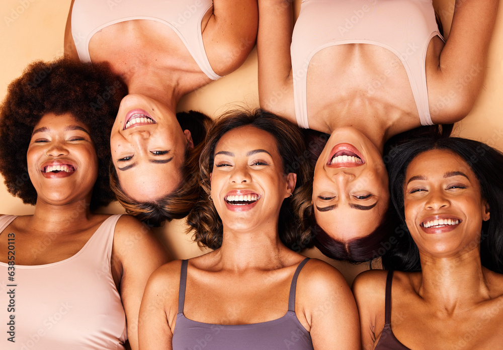 Poster Diversity, beauty and portrait of women from above with smile, self love and solidarity in studio. Happy face, group of friends on beige background with underwear, skincare and cosmetics on floor.