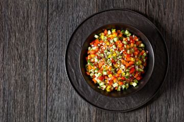 Israeli salad of finely diced veggies in bowl