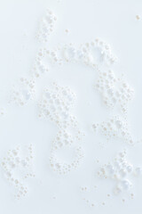 macro milk texture,White surface of milk and bubbles and ripples from above birds eye view