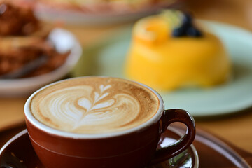 high angle view of coffee cup on wood grain table Drinking Concept: Hot Coffee, Latte, Espresso, Cappuccino