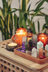Various minerals and healing crystals on a wooden tray