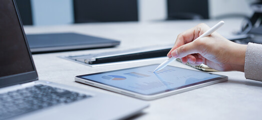 close up manager man hand use stylus pencil to point chart report dashboard on digital tablet for...