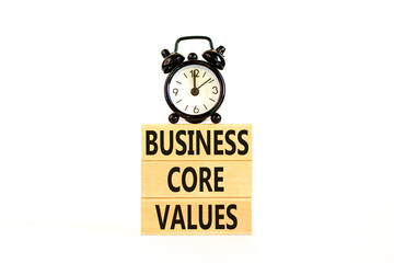 Business core values symbol. Concept words Business core values on wooden block. Beautiful white background. Black alarm clock. Business motivational business core values concept. Copy space.