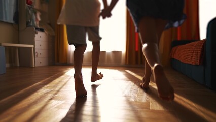 children run around the house barefoot. happy family childhood dream concept. a group of little kids running around the house and playing catch-up. children lifestyle have fun barefoot close up