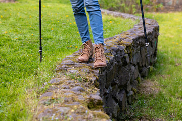 Close up of female legs and scandinavian sticks