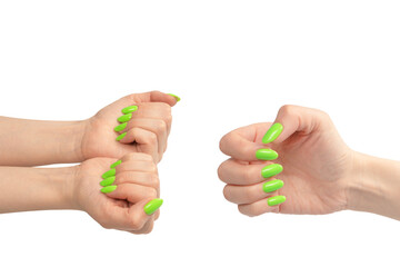 Hand of a woman with green naols hold some tiny or thin object.