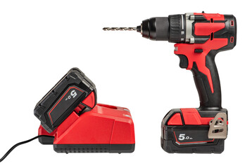 cordless drill with a drill on a white isolated background, side view. A set of a cordless drill...