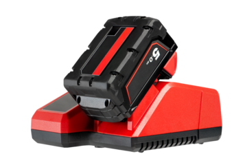 The process of charging a lithium battery from a cordless construction tool. The battery from the screwdriver is charged in the charger