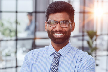 Close-up photo portrait of successful and happy businessman, male investor beard looking at camera