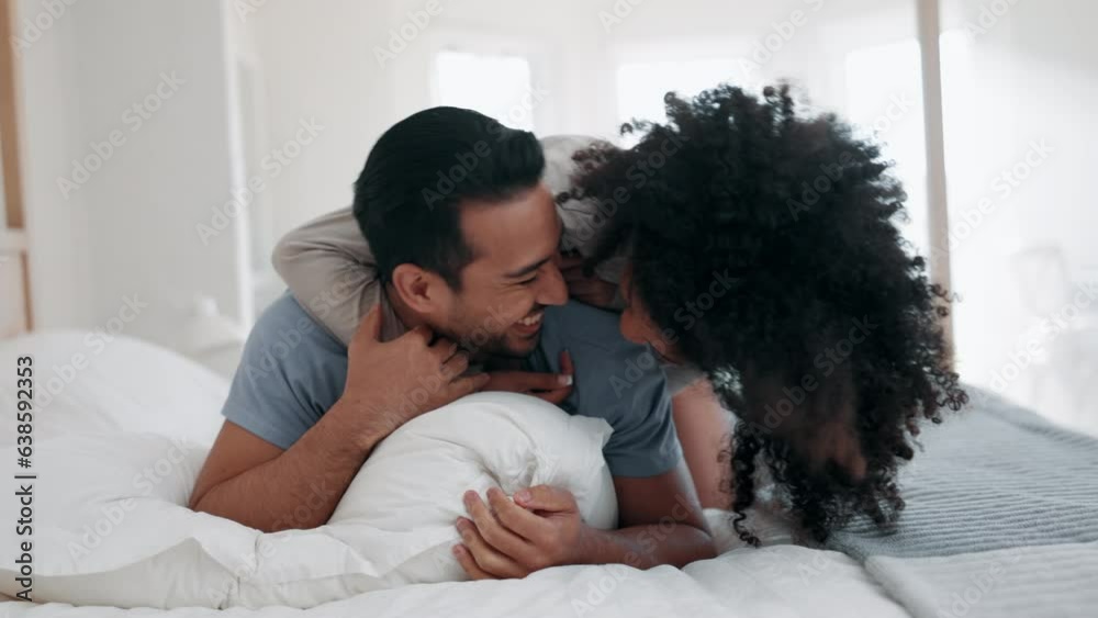 Poster Talking, hug and couple in bed, funny and bonding together in home to laugh. Embrace, interracial love and man and woman smile in bedroom in conversation, healthy connection and relax in the morning