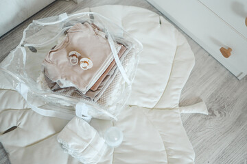 Bag with things to the maternity hospital, the concept of motherhood and expectation of a baby
