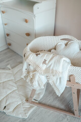Fototapeta na wymiar Muslin blanket on the cradle in the children's room