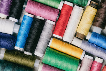 Set multicolored threads for cutting and sewing.