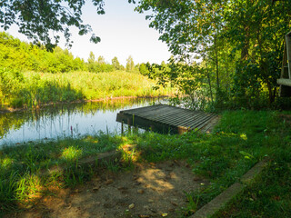 Fototapeta na wymiar Landscape shot of the pond. Outdoors
