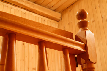 Handrails made by a carpenter inside a wooden house.