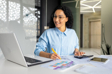Successful business woman financier on paper work with contracts, reports works sitting at...